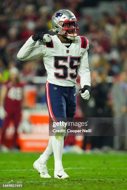 Josh Uche of the New England Patriots celebrates against the Arizona Cardinals at State Farm Stadium on December 12, 2022 in Glendale, Arizona.