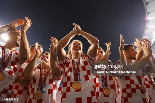 Domagoj Vida of Croatia celebrates with their FIFA World Cup Qatar 2022 third placed medal after the team's victory during the FIFA World Cup Qatar...