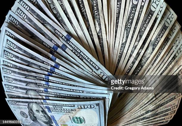 a stack of american currency fanned out - 100 dollar bill wallpaper stock-fotos und bilder