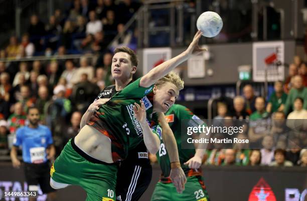 Thorgeir Gisli of Magdeburg challenges Justin Kurch of HC Erlangen during the LIQUI MOLY HBL match between SC Magdeburg v HC Erlangen at GETEC-Arena...