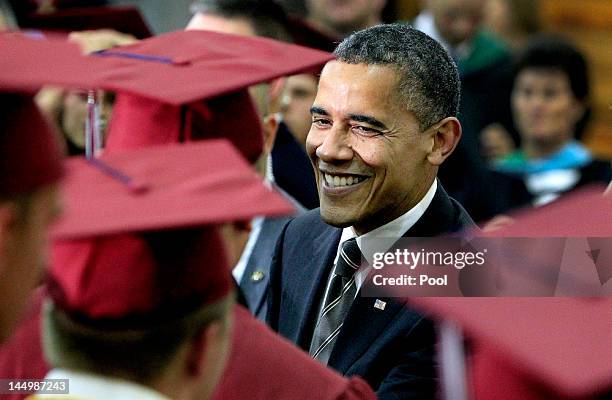 President Barack Obama greets Joplin High School graduates just before Monday night's commencement ceremony for the Class of 2012 at the Missouri...