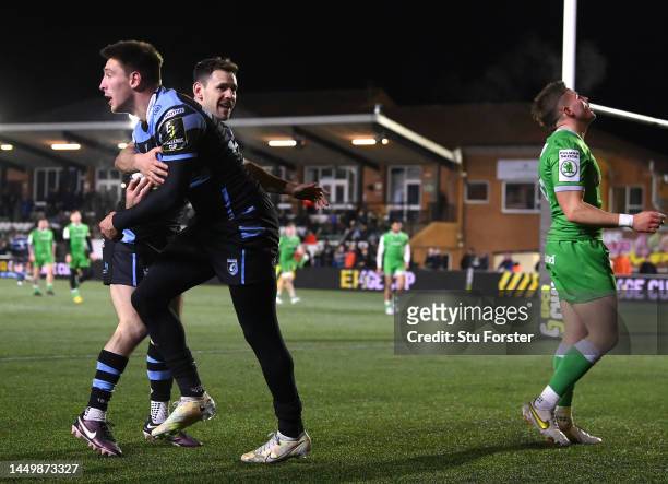 Cardiff Rugby wing Josh Adams is congratulated by Tomos Williams after scoring his second try during the Pool A Challenge Cup match between Newcastle...
