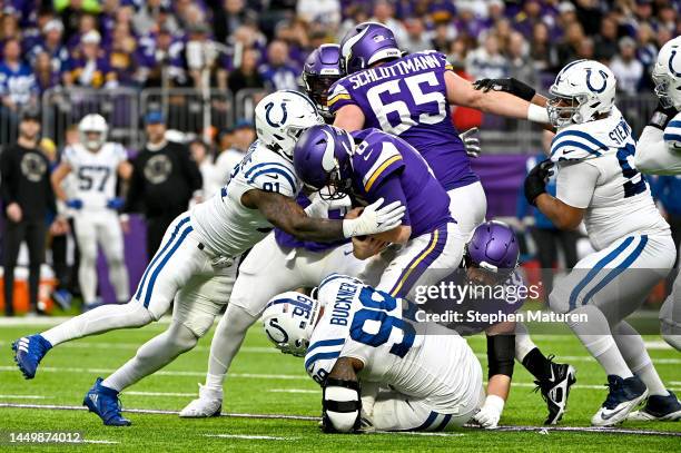 Yannick Ngakoue and DeForest Buckner of the Indianapolis Colts sack Kirk Cousins of the Minnesota Vikings during the second quarter of the game at...