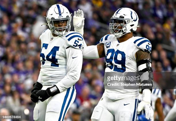 Dayo Odeyingbo and DeForest Buckner of the Indianapolis Colts react after a play against the Minnesota Vikings during the second quarter of the game...