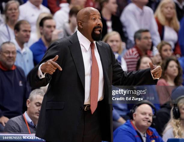 Head coach Mike Woodson of the Indiana Hoosiers directs his team against the Kansas Jayhawks in the second half at Allen Fieldhouse on December 17,...