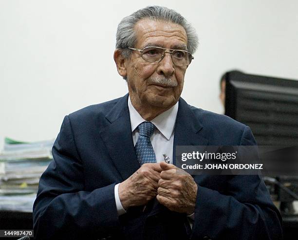 Guatemalan former de facto president and retired General, Jose Efrain Rios Montt, speak with journalist after a hearing regarding the massacre of 201...