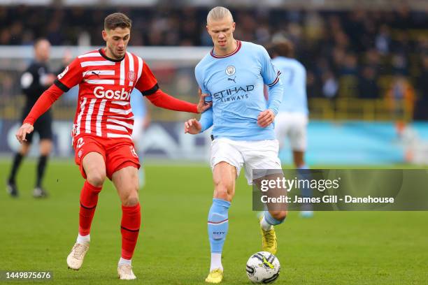 Erling Haaland of Manchester City battles for possession with Santiago Bueno of Girona during the friendly match between Manchester City and Girona...