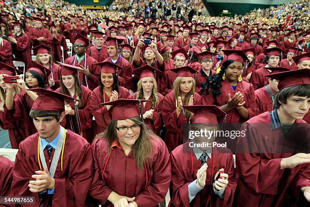 Graduating seniors of Joplin High School applaud U.S. President Barack Obama after his speech Monday night during the Joplin High School Commencement...