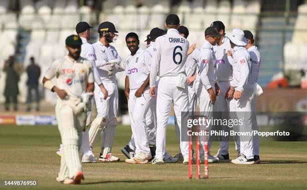 Rehan Ahmed of England watches Saud Shakeel of Pakistan leave the field on the first day of the third Test between Pakistan and England at Karachi...