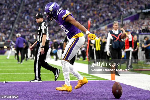 Justin Jefferson of the Minnesota Vikings celebrates after scoring a touchdown against the Indianapolis Colts during the fourth quarter of the game...