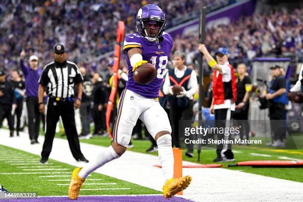 Justin Jefferson of the Minnesota Vikings scores a touchdown against the Indianapolis Colts during the fourth quarter of the game at U.S. Bank...