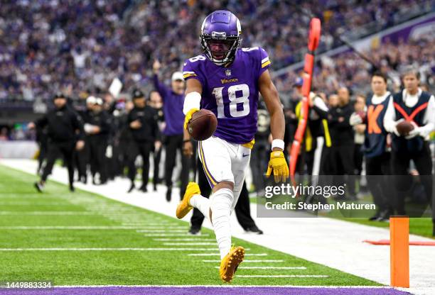 Justin Jefferson of the Minnesota Vikings scores a touchdown against the Indianapolis Colts during the fourth quarter of the game at U.S. Bank...