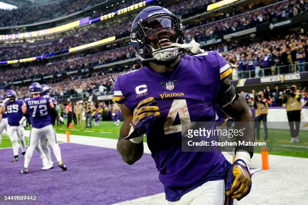 Dalvin Cook of the Minnesota Vikings celebrates after rushing for a touchdown against the Indianapolis Colts during the fourth quarter of the game at...