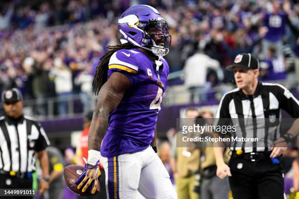 Dalvin Cook of the Minnesota Vikings celebrates after rushing for a touchdown against the Indianapolis Colts during the fourth quarter of the game at...