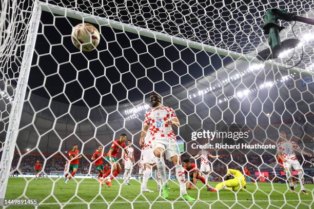 Achraf Dari of Morocco scores his team's first goal during the FIFA World Cup Qatar 2022 3rd Place match between Croatia and Morocco at Khalifa...