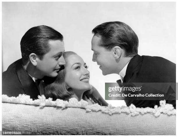Publicity portrait of, from left, actors Robert Young as 'Rudi Pal' , Joan Crawford as 'Anni' and Franchot Tone as 'Giulio' in the film 'The Bride...