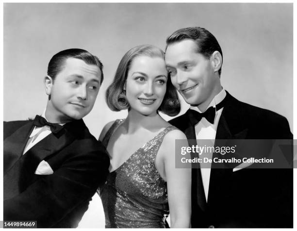 Publicity portrait of, from left, actors Robert Young as 'Rudi Pal' , Joan Crawford as 'Anni' and Franchot Tone as 'Giulio' in the film 'The Bride...