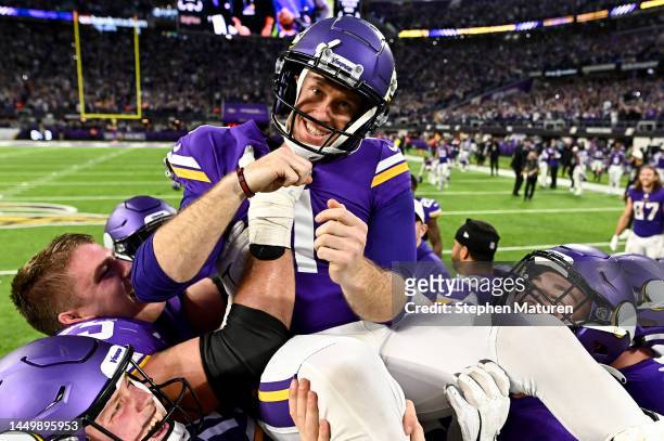 Greg Joseph of the Minnesota Vikings celebrates with teammates after hitting the game winning field goal in overtime against the Indianapolis Colts...