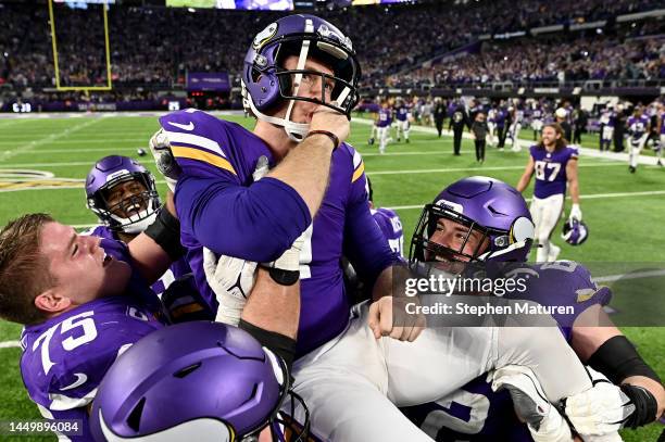 Greg Joseph of the Minnesota Vikings celebrates with teammates after hitting the game winning field goal in overtime against the Indianapolis Colts...