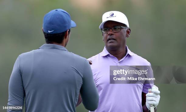 Vijay Singh annd Qass Singh shake hands on the 18th hole during the first round of the PNC Championship at Ritz-Carlton Golf Club on December 17,...