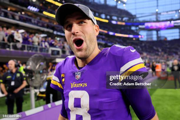 Kirk Cousins of the Minnesota Vikings celebrates on the field after defeating the Indianapolis Colts at U.S. Bank Stadium on December 17, 2022 in...