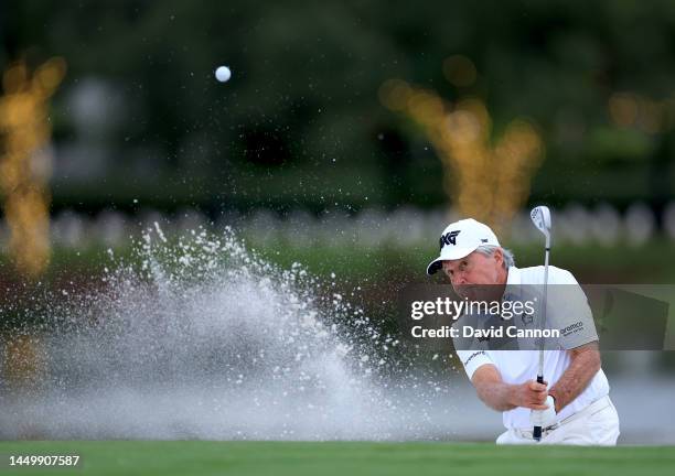 Gary Player of South Africa plays his third shot on the 18th hole during the first round of the 2022 PNC Championship at The Ritz-Carlton Golf Club...