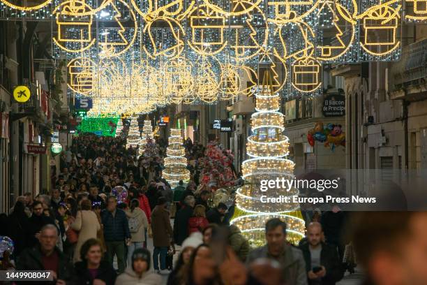 Several people walk through the center of the city of Vigo to enjoy the Christmas illumination, on 17 December, 2022 in Vigo, Pontevedra, Galicia,...