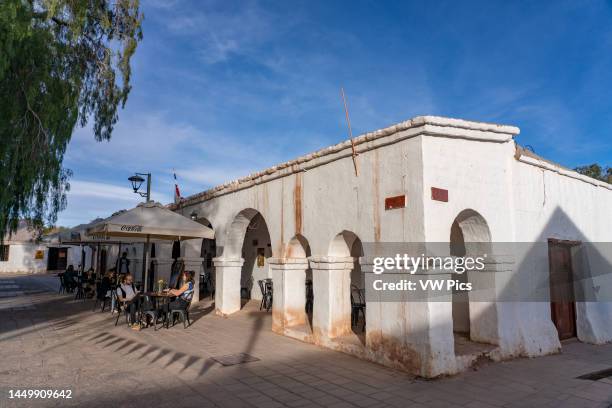 Tourists enjoy a meal al fresco around the main plaza in the town of San Pedro de Atacama in northern Chile.