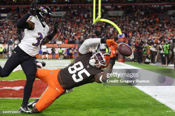 David Njoku of the Cleveland Browns is unable to make a catch while being defended by Chuck Clark of the Baltimore Ravens during the second quarter...