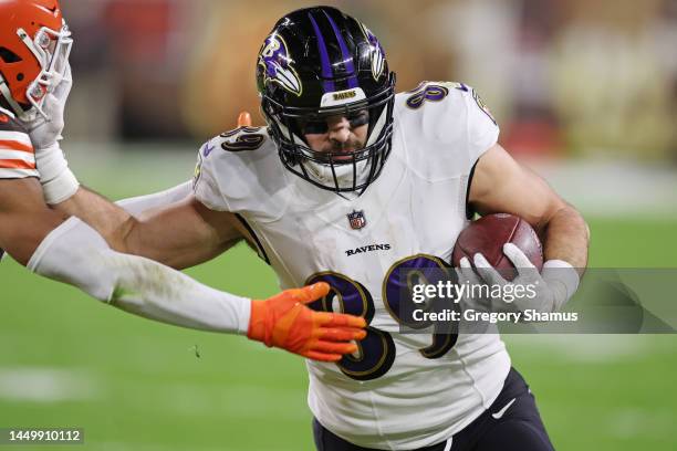 Mark Andrews of the Baltimore Ravens stiff arms Grant Delpit of the Cleveland Browns during the second quarter at FirstEnergy Stadium on December 17,...