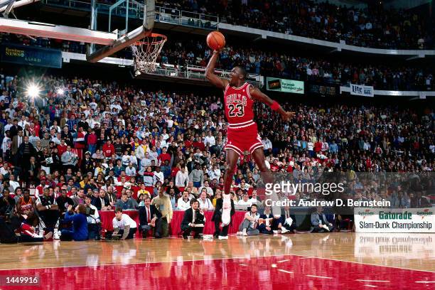 Michael Jordan of the Chicago Bulls goes for a dunk during the 1988 NBA All Star Slam Dunk Competition on February 6, 1988 at Chicago Stadium in...