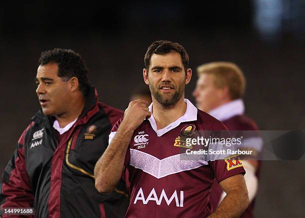 Maroons coach Mal Meninga and captain Cameron Smith look on during a Queensland Maroons State of Origin captain's run at Etihad Stadium on May 22,...
