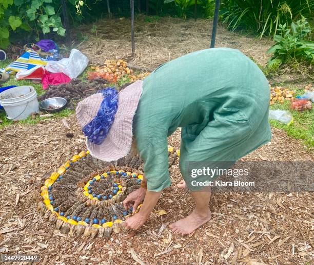 woman making garden art - art manke stock pictures, royalty-free photos & images