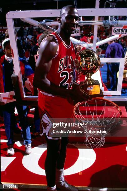 Michael Jordan of the Chicago Bulls celebrates after winning 1988 NBA All Star Slam Dunk Competition on February 6, 1988 at Chicago Stadium in...