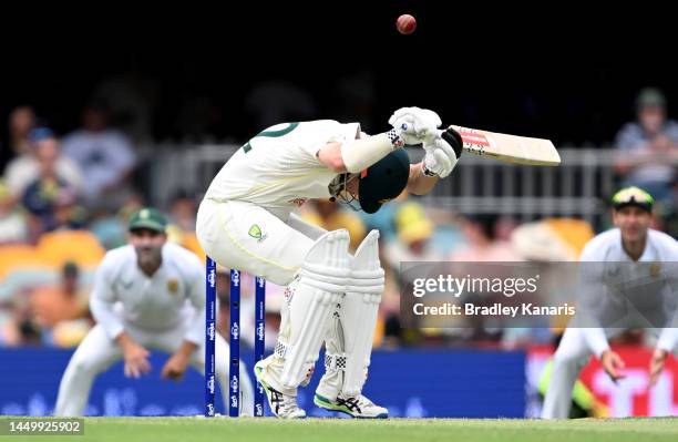 Travis Head of Australia ducks under a bouncer during day two of the First Test match between Australia and South Africa at The Gabba on December 18,...