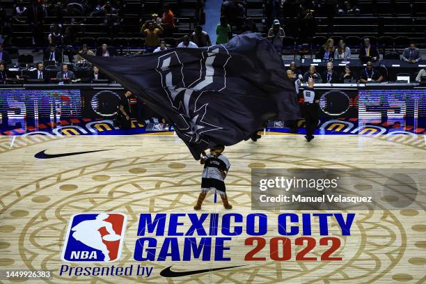 Coyote mascot of San Antonio Spurs waves a flag during the game between San Antonio Spurs against Miami Heat at Arena Ciudad de Mexico on December...