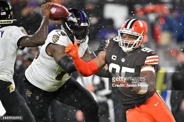 Myles Garrett of the Cleveland Browns is blocked by Morgan Moses of the Baltimore Ravens during the fourth quarter at FirstEnergy Stadium on December...