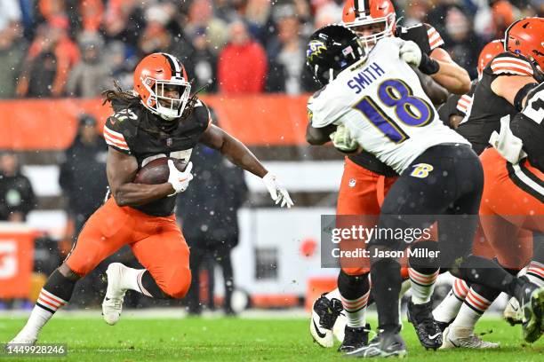 Kareem Hunt of the Cleveland Browns carries the ball against the Baltimore Ravens during the fourth quarter at FirstEnergy Stadium on December 17,...