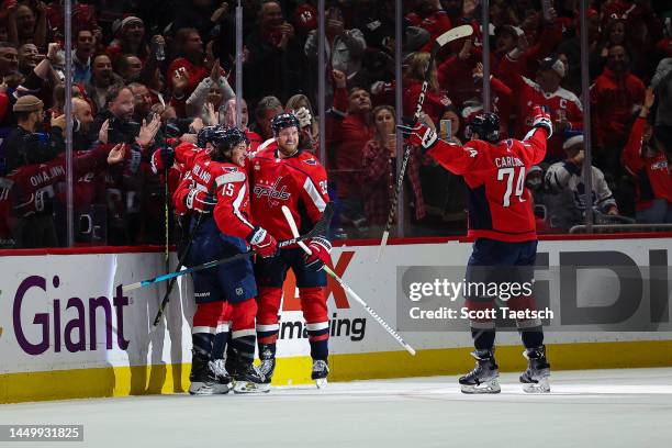 Erik Gustafsson of the Washington Capitals celebrates with teammates after scoring a goal against the Toronto Maple Leafs] during the first period of...