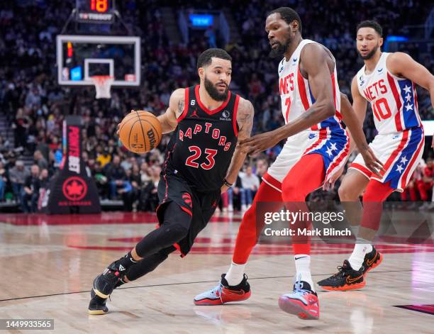 Fred VanVleet of the Toronto Raptors drives against Kevin Durant of the Brooklyn Nets during the second half of their basketball game at the...