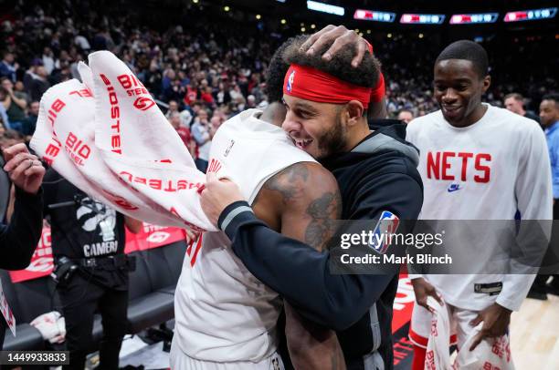 Kyrie Irving of the Brooklyn Nets celebrates his game winning buzzer beater shot with Seth Curry against the Toronto Raptors in their basketball game...