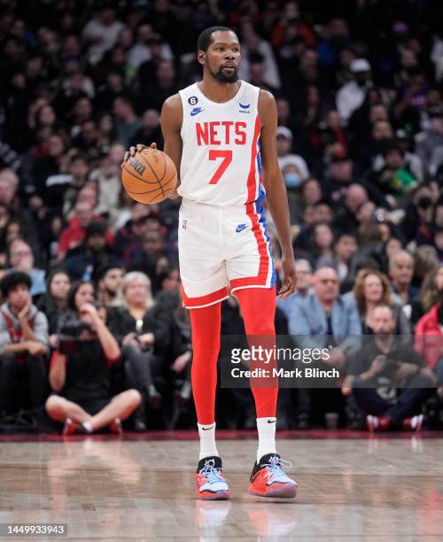 Kevin Durant of the Brooklyn Nets dribbles against the Toronto Raptors during the first half of their basketball game at the Scotiabank Arena on...
