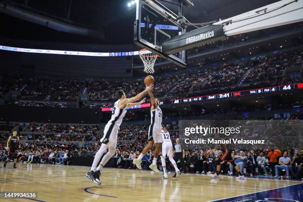 Tre Jones of the San Antonio Spurs recovers a ball during the game between San Antonio Spurs against Miami Heat at Arena Ciudad de Mexico on December...