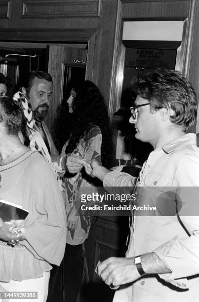 George Schlatter and Cher attend a preview screening of "Rollerball" at the Directors Guild of America headquarters and an afterparty at Chasen's in...
