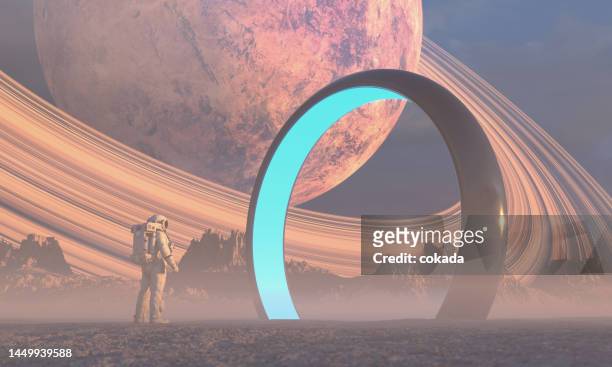 astronaut in front of dimensional portal - cosmonaut stock pictures, royalty-free photos & images