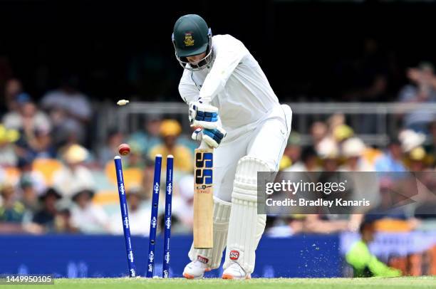 Rassie van der Dussen of South Africa is clean bowled by Mitchell Starc of Australia who celebrates taking his 300th Test Wicket during day two of...