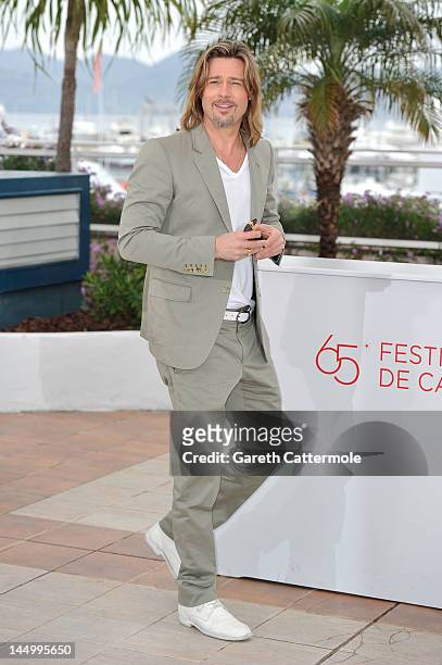 Actor Brad Pitt poses at the 'Killing Them Softly' photocall during the 65th Annual Cannes Film Festival at Palais des Festivals on May 22, 2012 in...