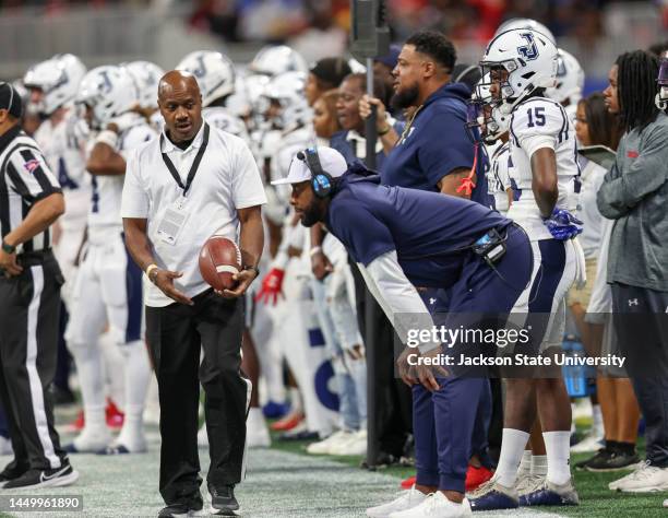 Incoming head coach TC Taylor surveys to game during the Jackson State Tigers and North Carolina Central Eagles Celebration Bowl Football...