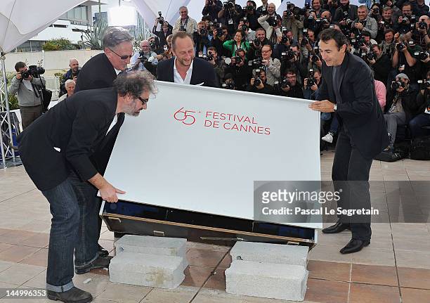 Actor Gustave Kerven, director Benoit Delepine, actor Benoit Poelvoorde and actor Albert Dupontel pose at the 'Le Grand Soir' photocall during the...