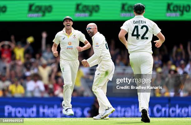 Nathan Lyon of Australia celebrates taking the wicket of Temba Bavuma of South Africa during day two of the First Test match between Australia and...